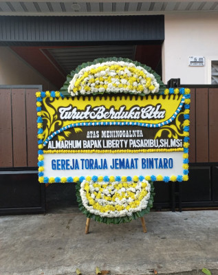 Papan Bunga Duka di Monta